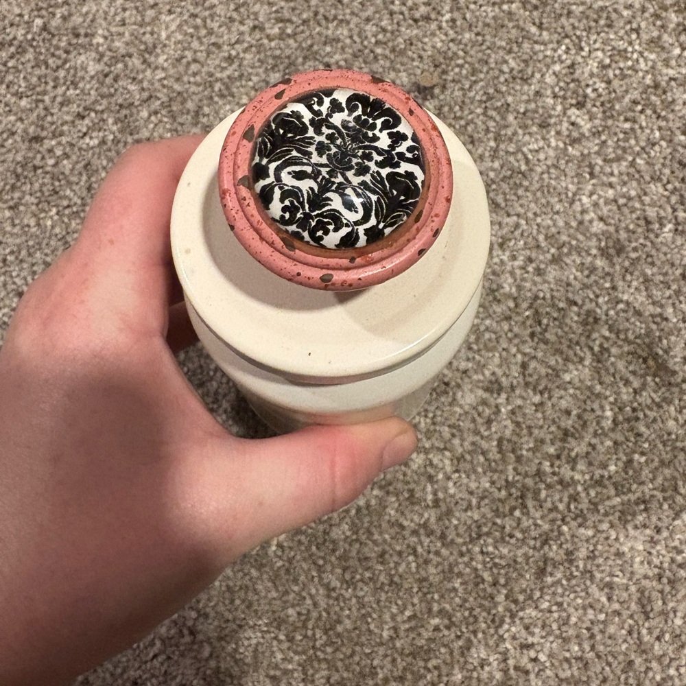 Handmade storage jar with pretty design decor on top